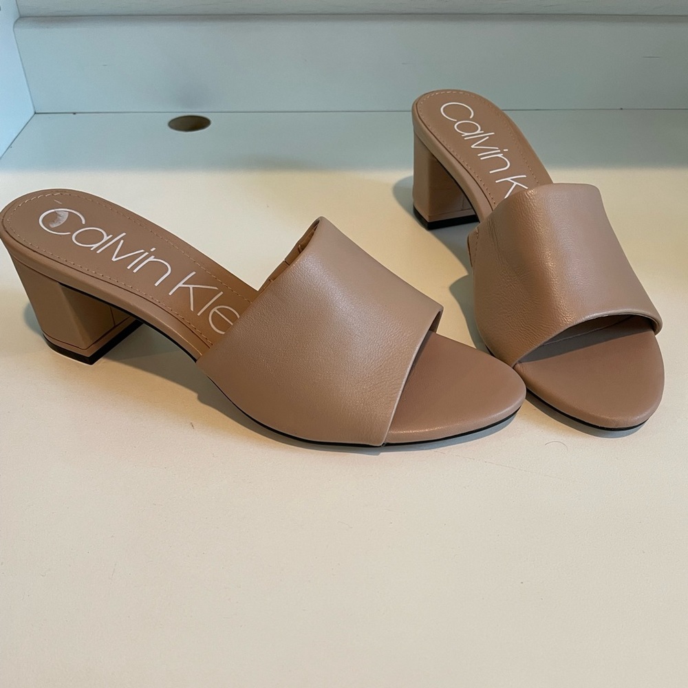 Brand New with Tag Calvin Klein heels! Size 7.5. Nude!